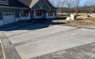 Decorative concrete driveway with gray stamped borders and broom finish center in Knoxville, Tennessee