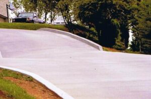 broom finish concrete driveway with curbs in Knoxville TN – Crescostone project example for concrete contractor FAQ