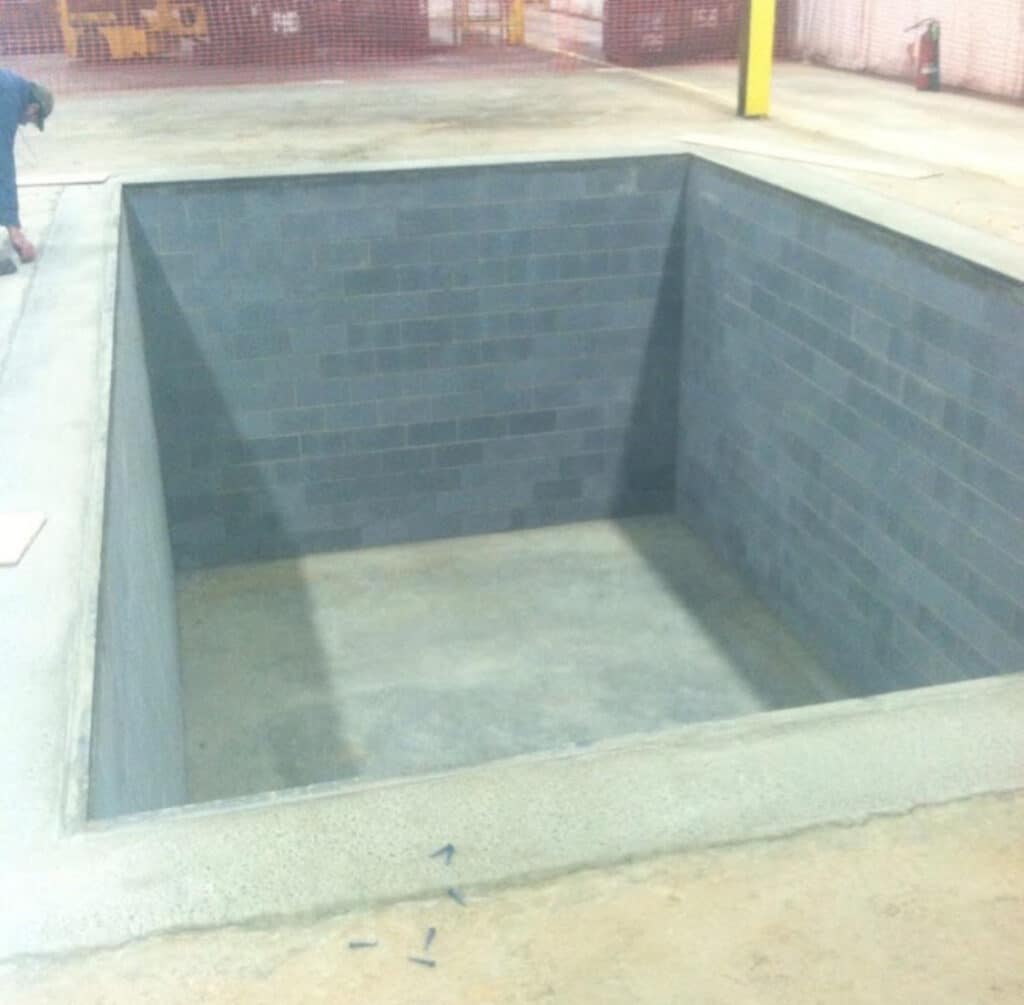 commercial concrete containment pit with block walls at Reynold Jeffrey industrial facility in Morristown TN