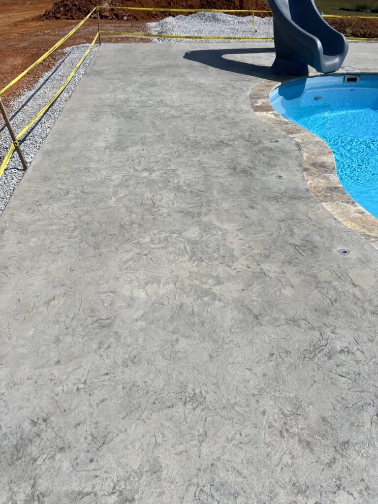 Decorative concrete pool deck installed by Morristown concrete contractor Crescostone in Morristown Tennessee