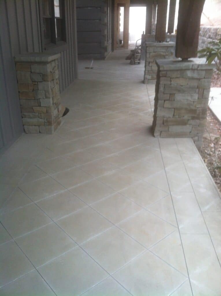 Decorative saw-cut concrete patio installed by Crescostone at a residential property in Sevierville Tennessee