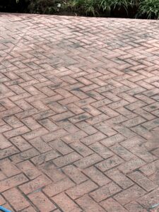 close up look of herringbone brick stamped red antiqued technique decorative concrete