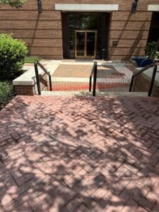 herringbone brick red antiqued decorative concrete next to the Knox County Public Library