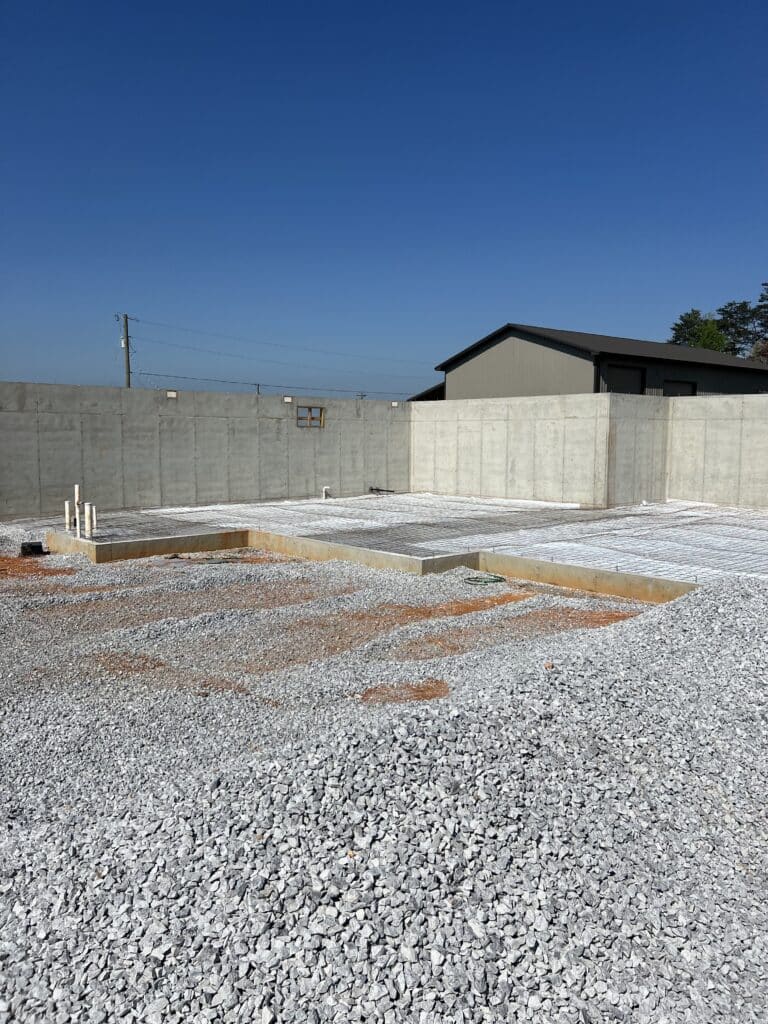 Ground, vapor barrier concrete slab foundation preparation before a Crescostone concrete installation in East Tennessee